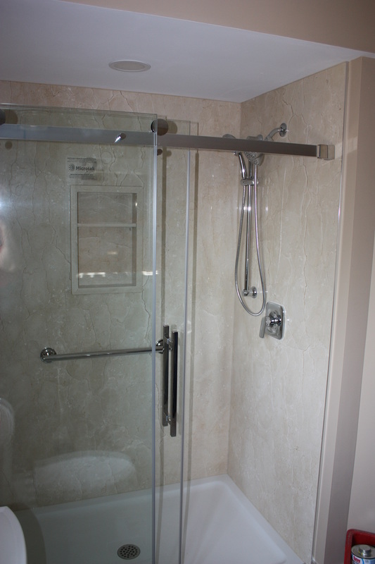 Picture stone panel shower, glass sliding door, Crema Marfil Marble panels