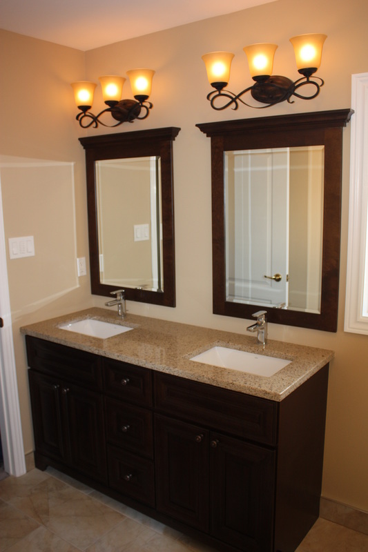 Picture double furnitre style vanity from Rock Soild. Matching mirrors, Moen chrome faucets