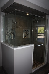 Custom glass package and tiled shower.